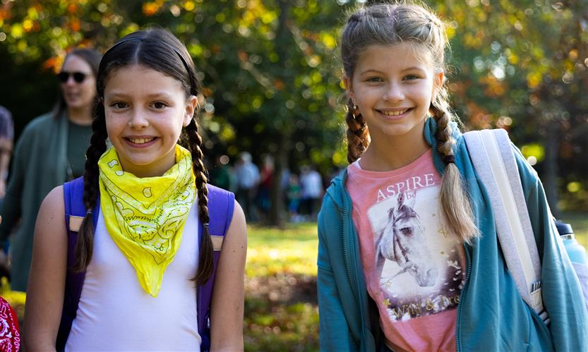 Students wearing western wear walk to school